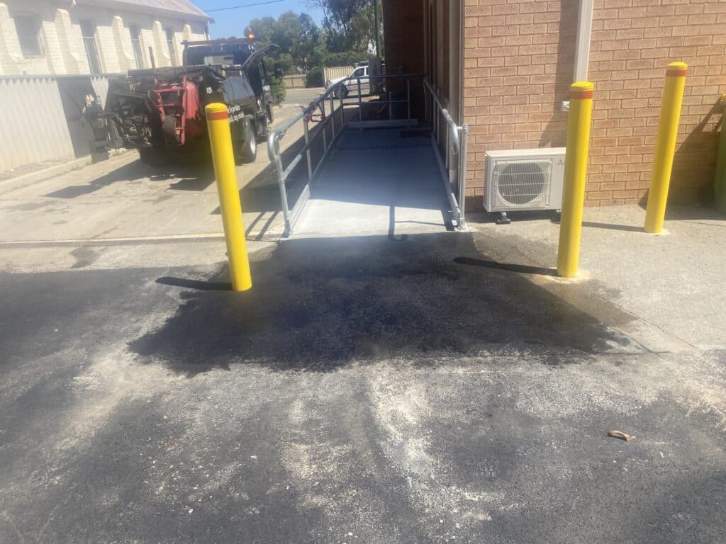 Installed asphalt ramp, job completed, looking up the ramp.