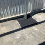 Asphalt patch repair to cover shed post footing, repair completed