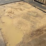 Before image of an asphalt reinstatement for VT Plumbing Group in Maddington, Western Australia
