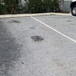 Before image of an asphalt pothole repair for Profile Packaging in Osborne Park, Western Australia