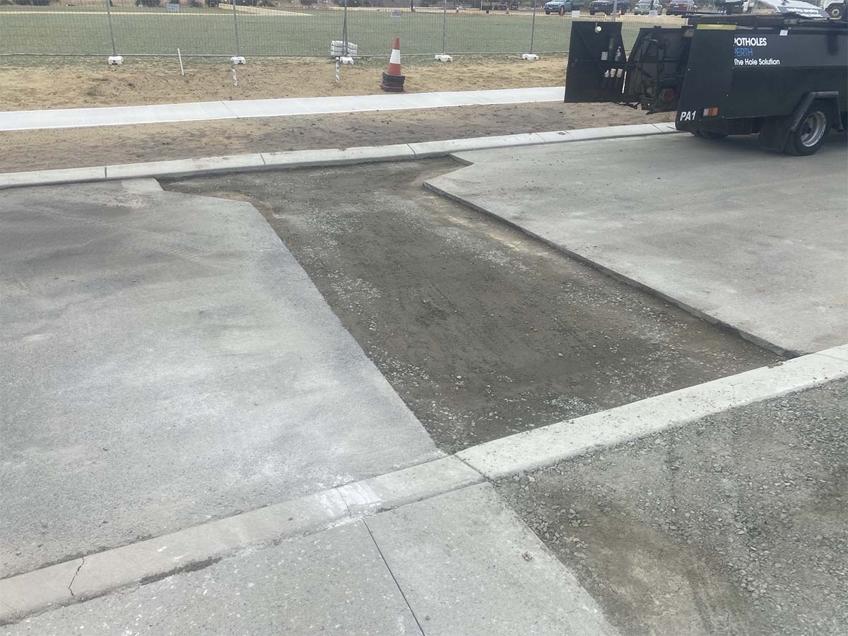 Before image of an asphalt reinstatement in Cockburn Central, Western Australia for Civcon Civil & Project Management.